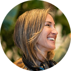 Smiling attendee at Eudēmonia summit