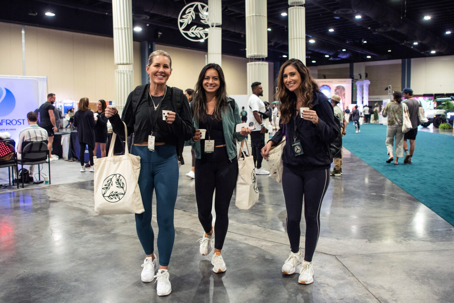 3 female attendees at the EXPOSŌME at Eudēmonia Summit.